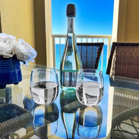 Drinks on a table overlooking a bayside view